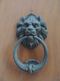 Close-up of sculpture on wooden door