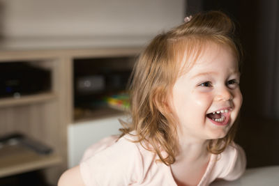 Portrait of a smiling girl at home