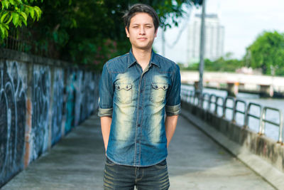 Portrait of young man standing outdoors