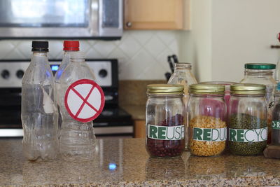 Close-up of legumes in glass jar at kitchen