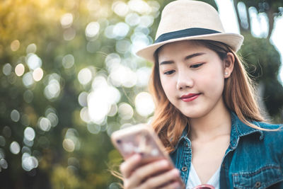 Portrait of mature man using mobile phone outdoors