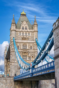 View of bridge over river against sky in city