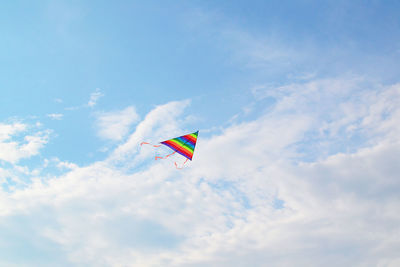 Low angle view of kite flying against sky