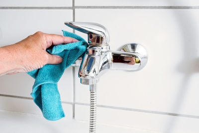 Cropped hand of person washing hands