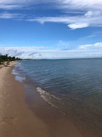 Scenic view of beach against sky