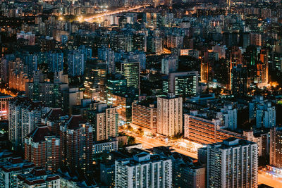 High angle view of illuminated buildings in city