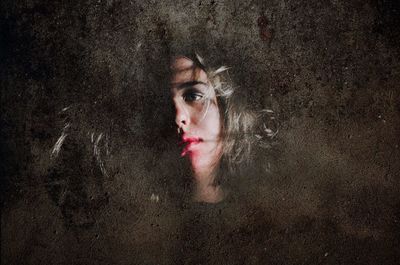 Portrait of a woman on wet surface