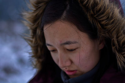 Close-up of sad woman during winter