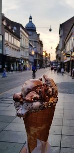 Ice cream cone on street in city