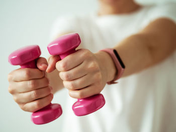 Close-up of hand holding pink hands