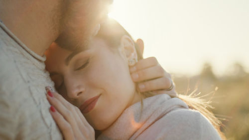 Couple of italian girl and boy hug each other intensely