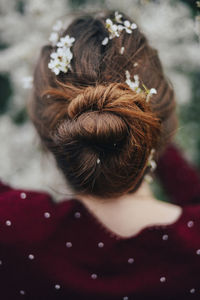 Close-up portrait of a girl with pink flower