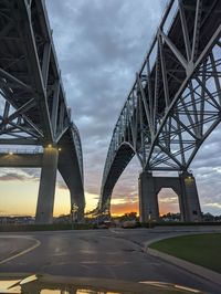 Low angle view of bridge against sky during sunset