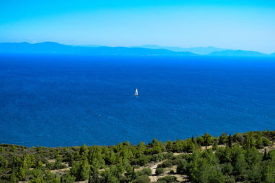 Scenic view of sea against blue sky