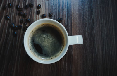High angle view of coffee cup on table