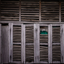 Full frame shot of closed wooden window of building