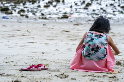 Rear view of woman on beach