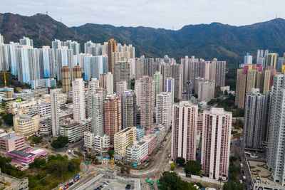 High angle view of city buildings against sky