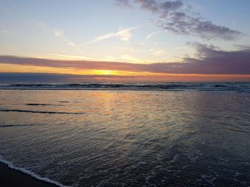 Scenic view of sea against sky at sunset