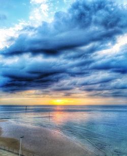 Scenic view of sea against cloudy sky