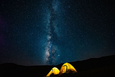 Low angle view of tent against sky at night