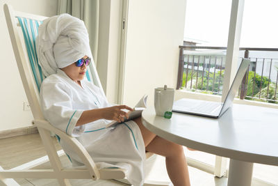 Young woman using laptop at home