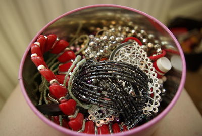 Close-up of jewelries in container