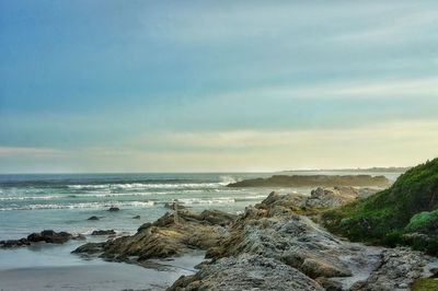 Scenic view of sea against cloudy sky