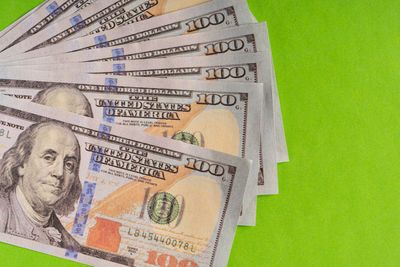 Close-up of information sign on green background