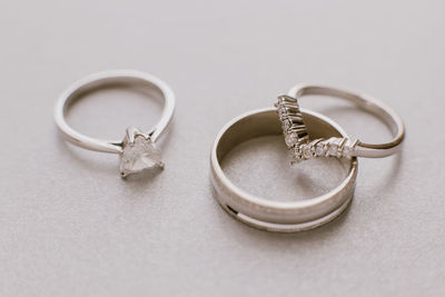 Close-up of wedding rings on table