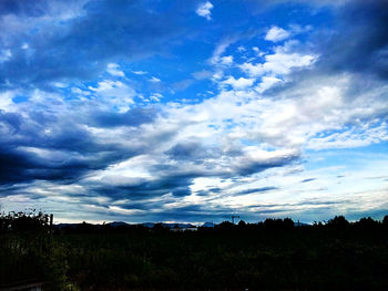 Scenic view of landscape against cloudy sky