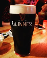 Close-up of beer glass on table