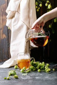 Midsection of wineglass on table