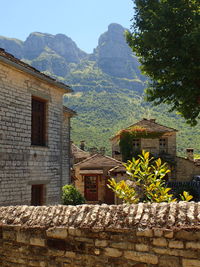 Buildings against mountain range