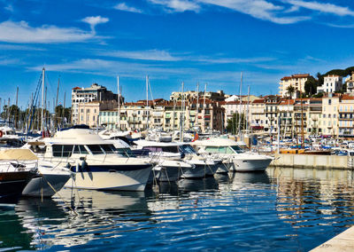 Boats moored at harbor