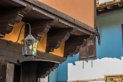 Low angle view of clothes hanging on roof of building