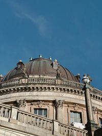 Low angle view of building against blue sky