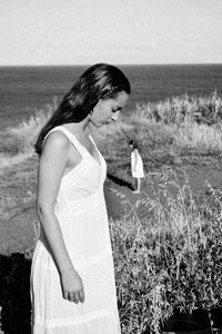 Young woman standing on beach