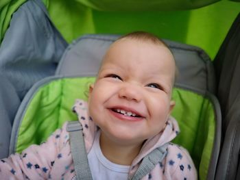 High angle portrait of smiling girl in stroller