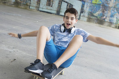 Boy with skateboard on the street