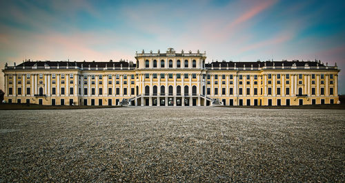 Building against sky at sunset