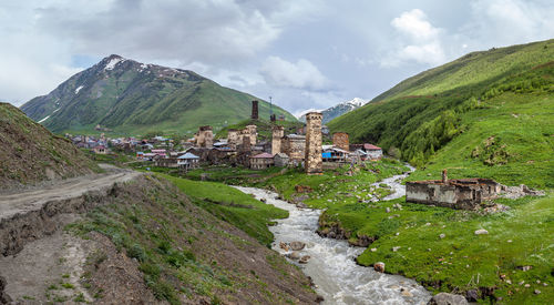 Panoramic view of buildings and mountains against sky