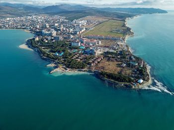 High angle view of sea by residential district