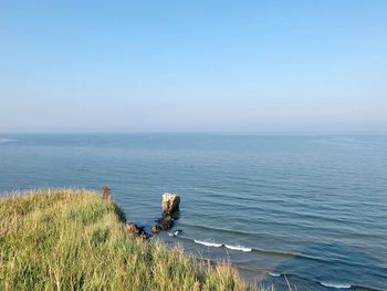 Scenic view of sea against clear sky