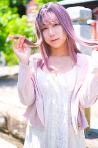 Portrait of beautiful  japanese young woman standing outdoors