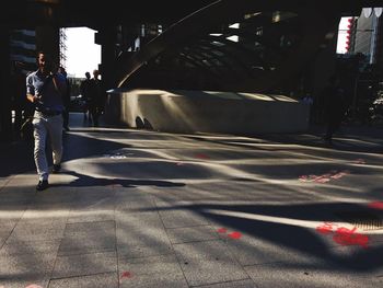 Man walking on street in city