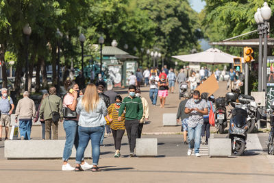 People walking on road in city