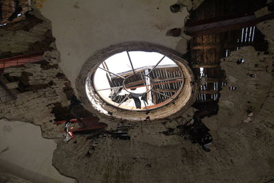 Reflection of abandoned building in mirror
