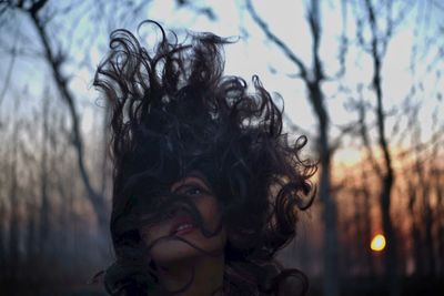 Close-up of woman with tousled hair 