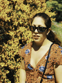 Portrait of young woman wearing sunglasses